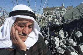 An elderly Palestinian ponders the prospects for his future in front of the remains of his house, after it was demolished by Israeli occupiers.