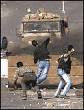 Ariel Sharon regards these boys, who are resisting invaders that want to rob them of their homes, terrorists. USA President George W Bush agrees with him.