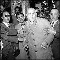 Mossadeq at the trial after the coup, at which he was sentenced by the Shah?s courts to three years, and prevented from entering politics again.