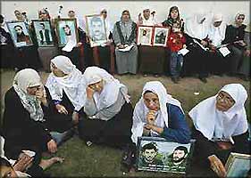 These Palestinian mothers spent Eid holding photos of their children who, like 7,000 other Palestinians, are in illegal Israeli detention without prospect of legal redress.