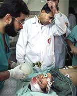 Eleven-year-old Jehid Abu Shekhah was shot through the head with a high velocity bullet by Israeli snipers, which crushed his brain. He died shortly after this photo was taken.