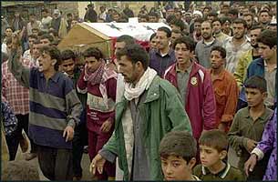Overcome with admiration for their liberation, Shias from Sadr City deliver a box of fresh meat to the USA forces.