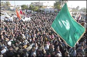 Iraqis demonstrate for elections. Since the war was supposed to be about liberation, why talk of imposing constitutions through unelected ?ruling councils??