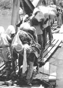 Refugees flee across the Jordan river, 1967.&nbsp; In successive phases since 1948, more than a million Palestinians have been forced from their cities and villages.