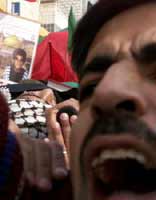 Palestinian Ramsi Hadl, 15, is carried during his funeral in Ramallah, December 6, 2000. Hadl was shot in the face and killed with a live bullet during street protests.