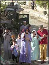 Destitute Nation. A Palestinian family in Jenin, pictured moments before the Israeli occupation forces blew up their home.
